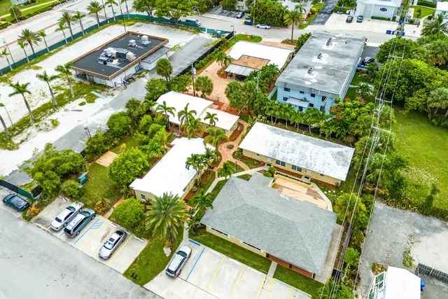 an aerial view of residential houses with outdoor space