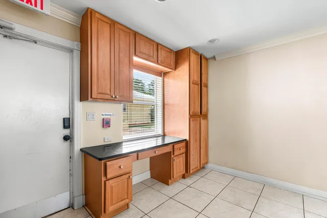 a kitchen with granite countertop cabinets and sink