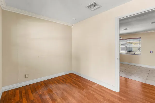 a view of an empty room and window