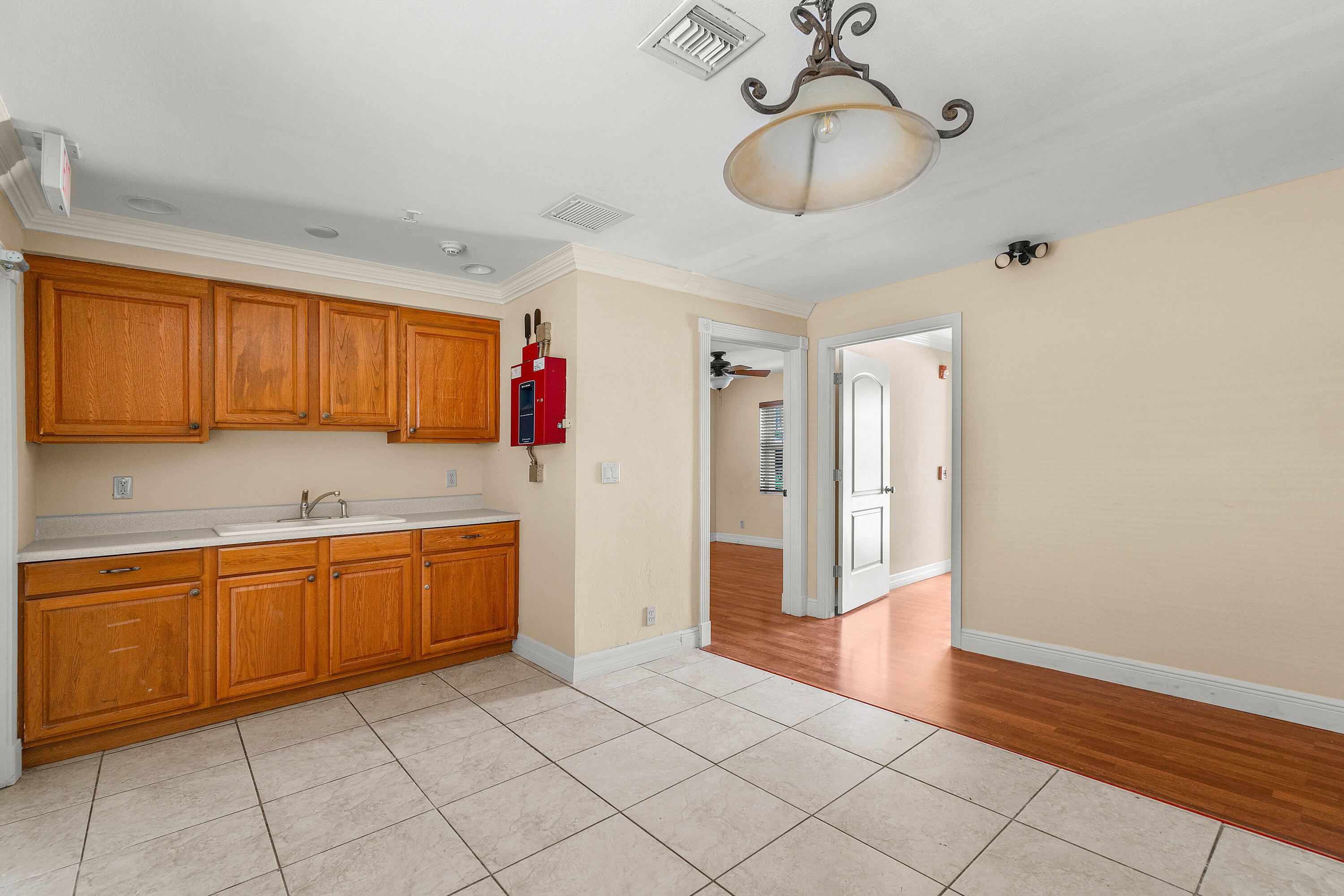 2637 West West Way, Unit A Riviera Beach, FL 33404 - Photo 37 of 42 a kitchen with granite countertop cabinets and sink