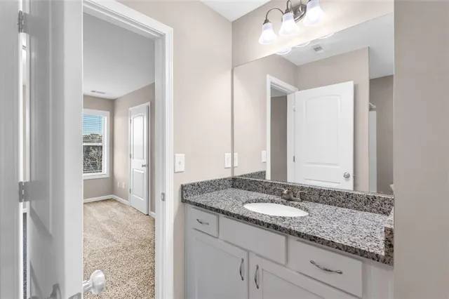 a view of a livingroom with an empty space and a window
