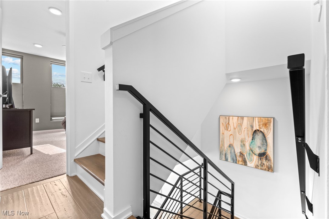 2317 Scranton Road Cleveland, OH 44113 - Photo 17 of 27 Stairs with wood finished floors and recessed lighting