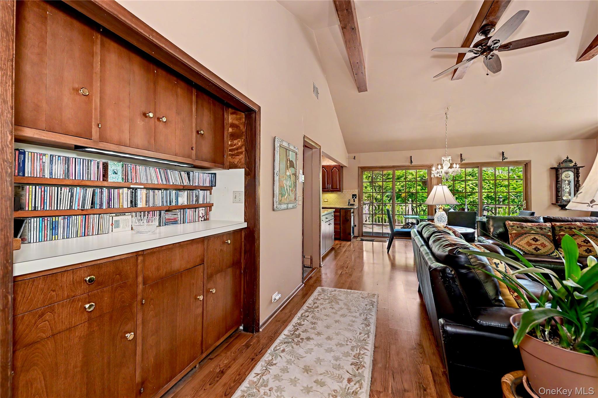 631 Croton Falls Road Carmel, NY 10512 - Photo 14 of 43 a living room with furniture potted plant floor to ceiling window and a flat screen tv