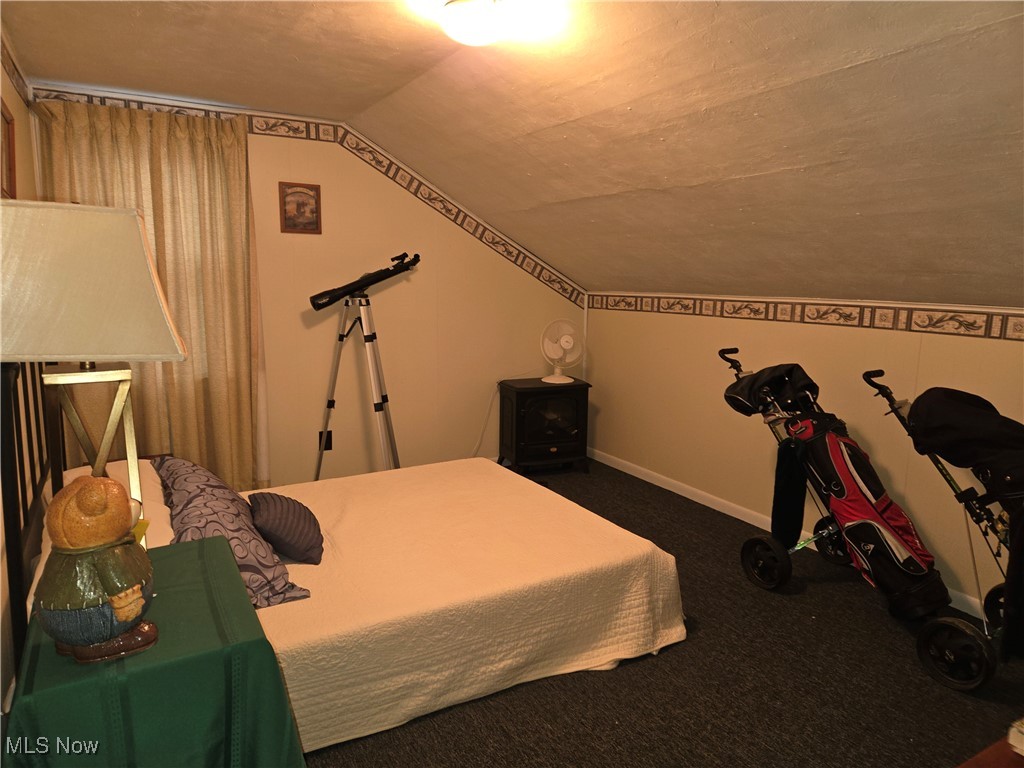 1962 Zenobia Road Norwalk, OH 44857 - Photo 15 of 30 Carpeted bedroom featuring vaulted ceiling