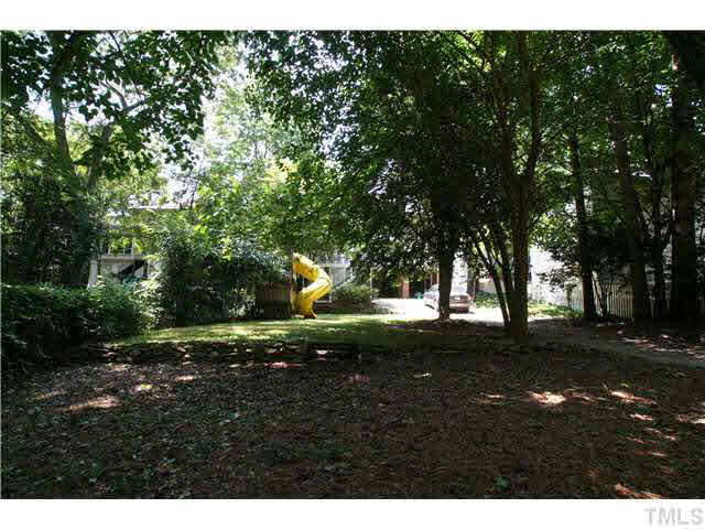 2112 Fairview Road Raleigh, NC 27608 - Photo 19 of 25 a view of a yard with plants and trees