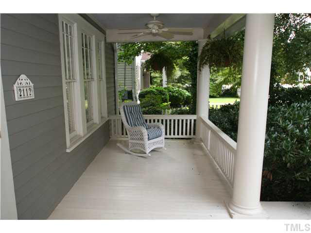 2112 Fairview Road Raleigh, NC 27608 - Photo 3 of 25 a view of a porch with furniture and floor to ceiling window