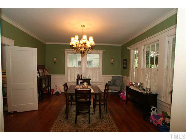 2112 Fairview Road Raleigh, NC 27608 - Photo 6 of 25 a view of a dining room with furniture and wooden floor