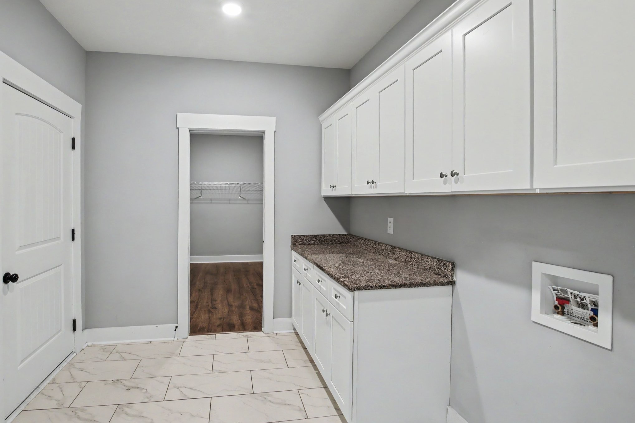 7208 Winding Way Pleasant View, TN 37146 - Photo 7 of 30 a kitchen with white cabinets and a sink