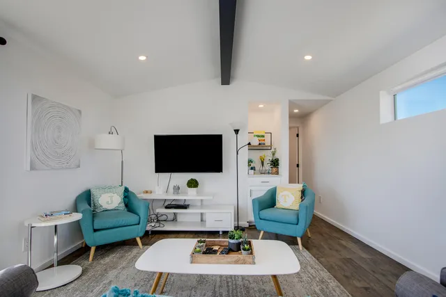 a kitchen with stainless steel appliances granite countertop a sink and a stove