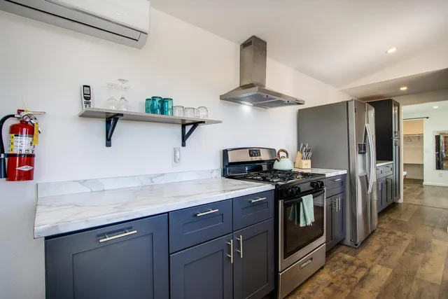 a view of storage and utility room with racks on the wall