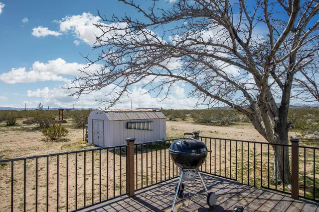 a view of a back yard from a balcony