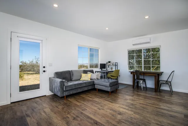 a bedroom with a bed and a couch