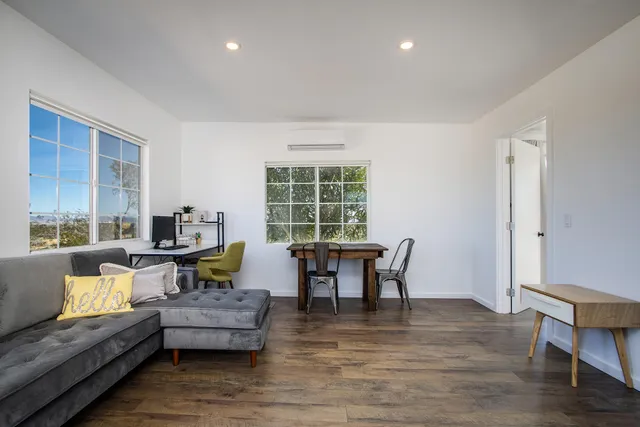 a bathroom with a sink mirror and vanity