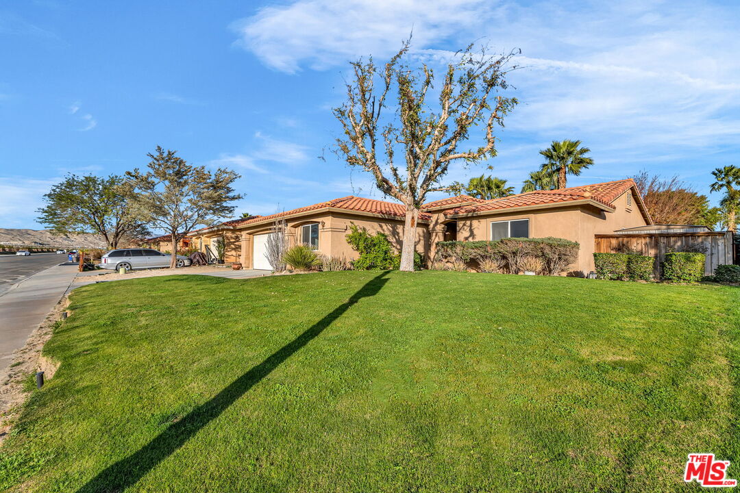 30940 Robert Road Thousand Palms, CA 92276 - Photo 4 of 48 a front view of a house with garden