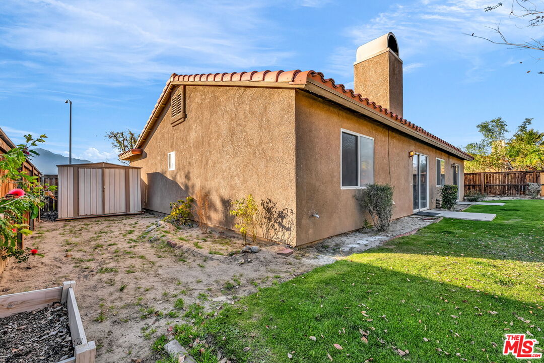 30940 Robert Road Thousand Palms, CA 92276 - Photo 44 of 48 a backyard of a house with lots of green space