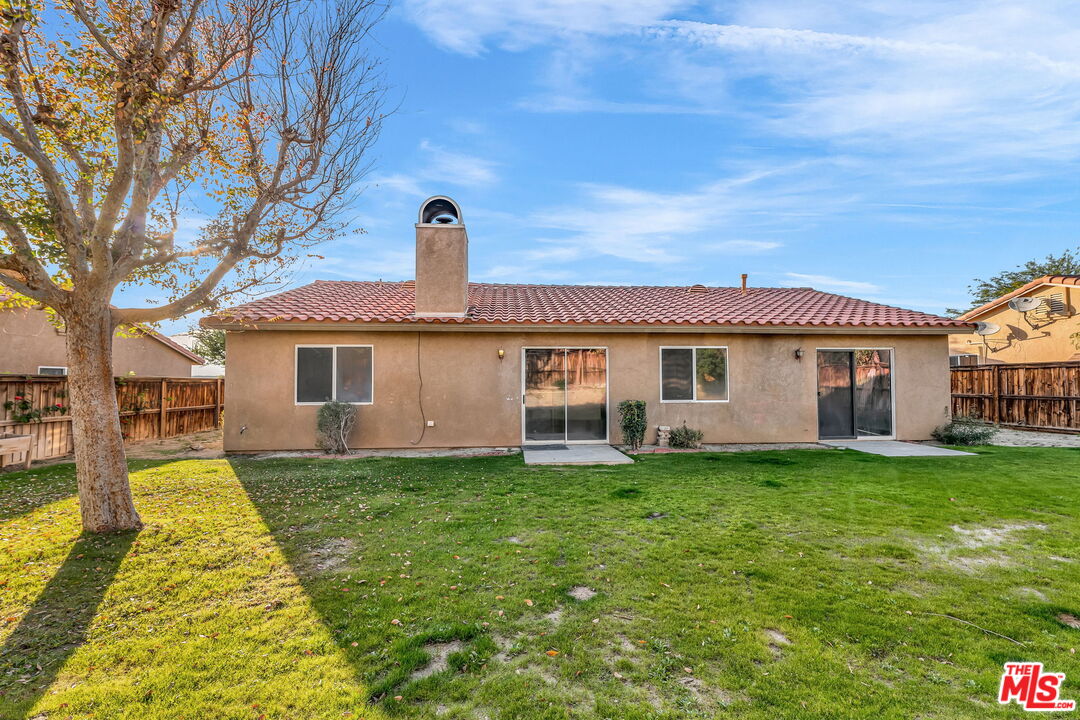 30940 Robert Road Thousand Palms, CA 92276 - Photo 46 of 48 a front view of a house with a yard