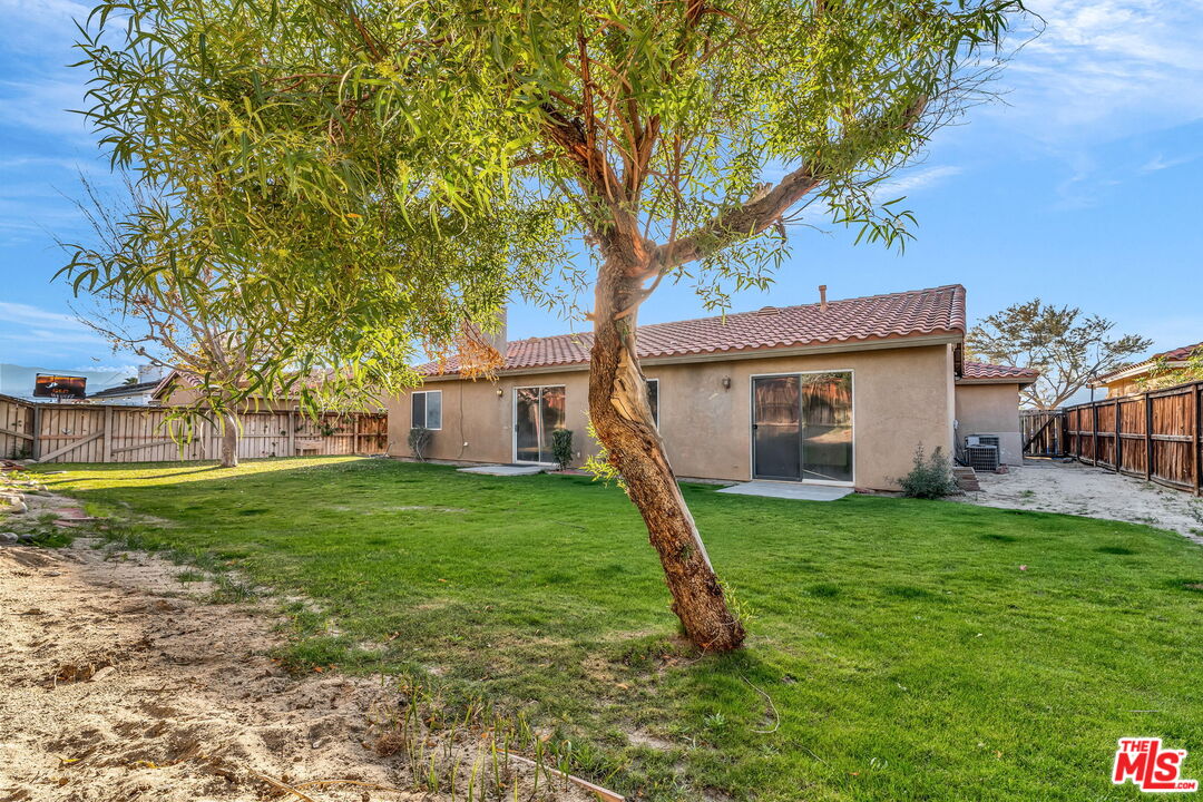 30940 Robert Road Thousand Palms, CA 92276 - Photo 47 of 48 a view of a house with a backyard