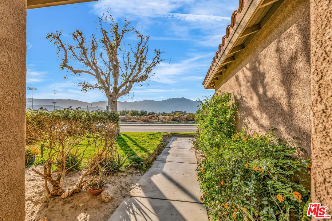 30940 Robert Road Thousand Palms, CA 92276 - Photo 7 of 48 a view of a lake with a house in the background