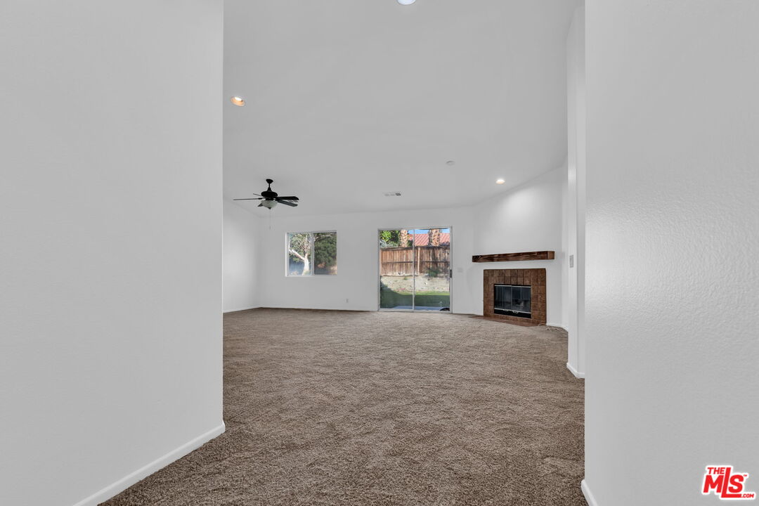 30940 Robert Road Thousand Palms, CA 92276 - Photo 8 of 48 a view of a livingroom with a fireplace