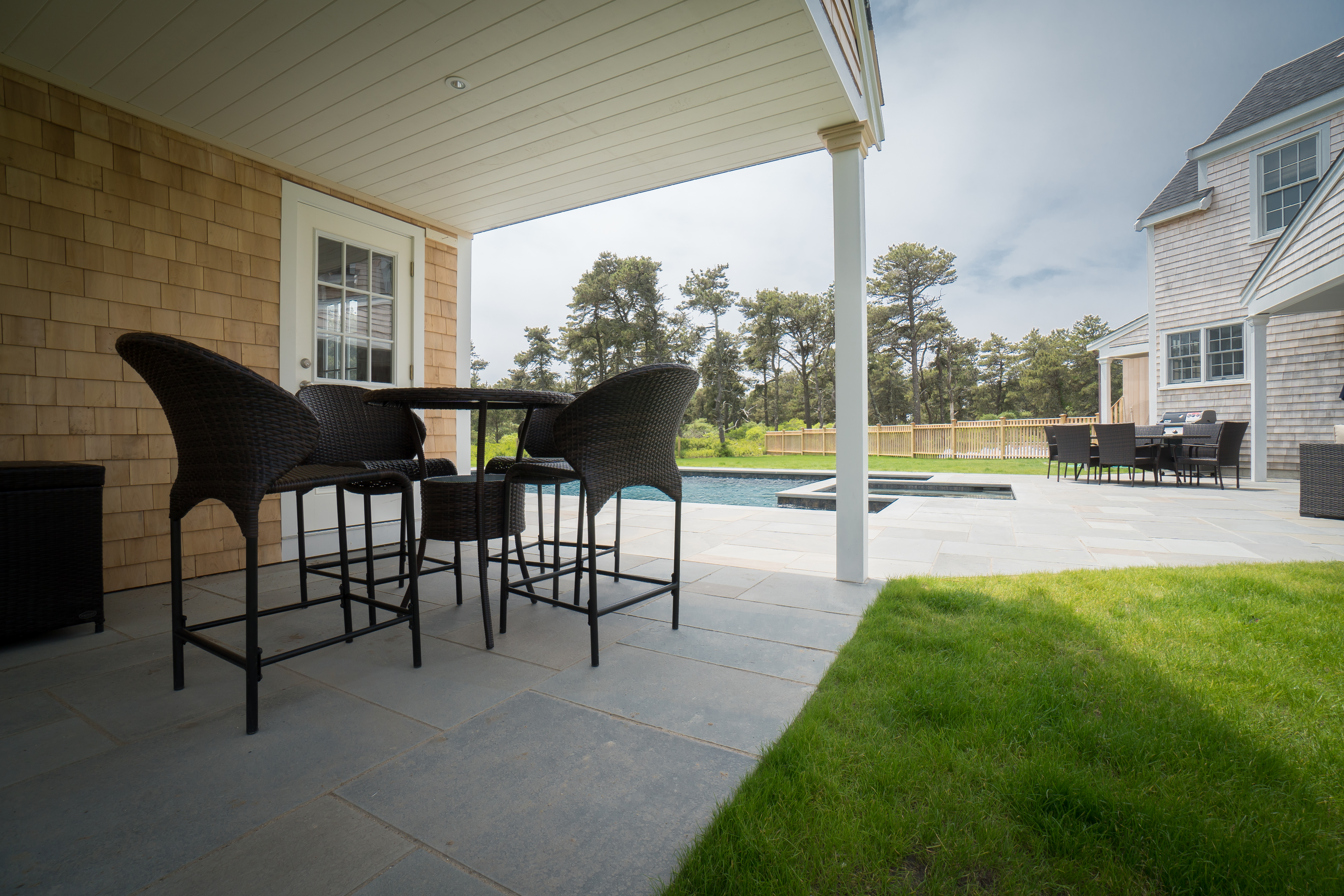 50 Lovers Lane Nantucket, MA 02554 - Photo 31 of 34 a view of a swimming pool with a table and chairs