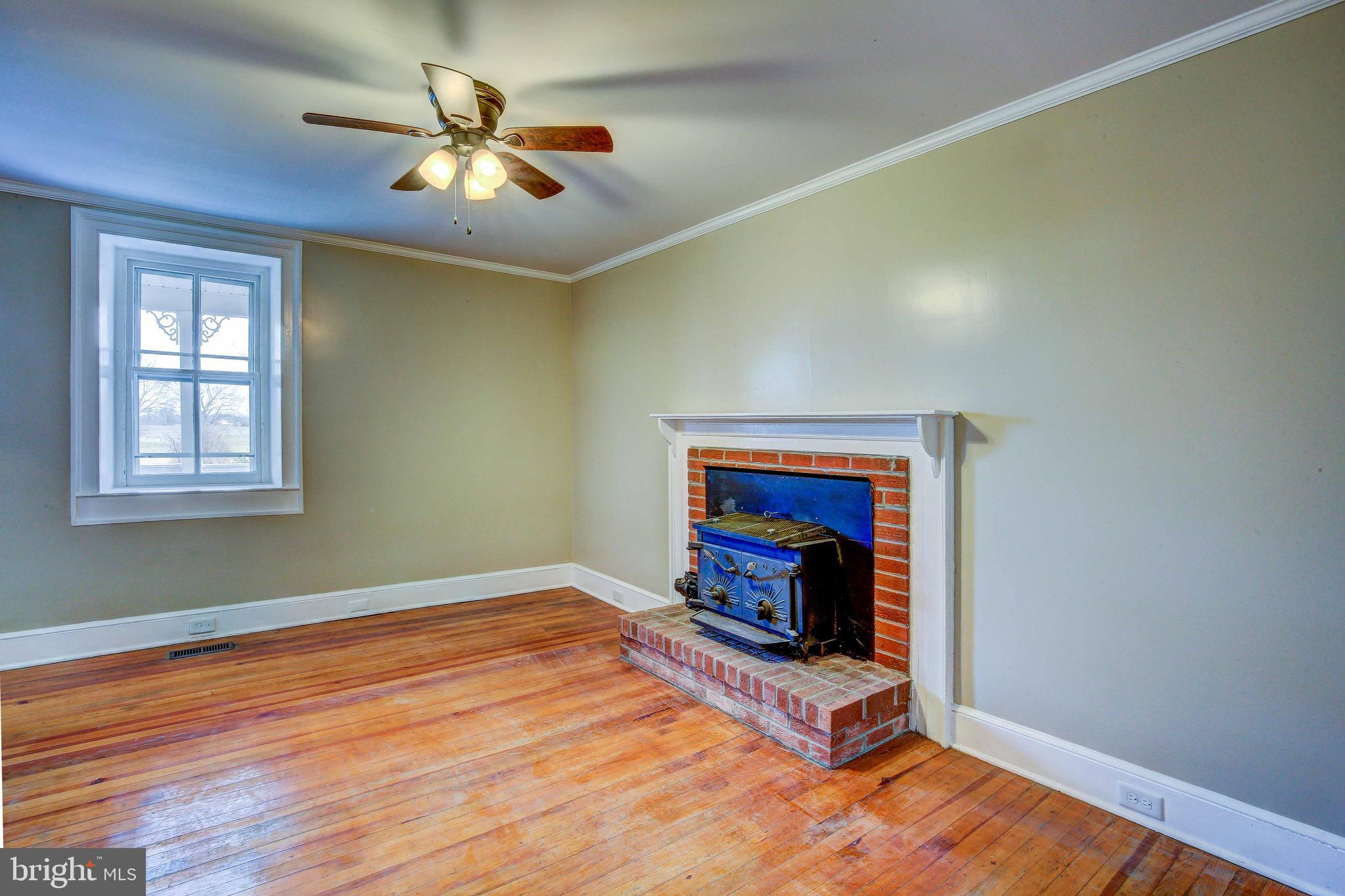 25208 Jerusalem Road Milford, VA 22514 - Photo 15 of 58 Family room off of the kitchen with wood stove