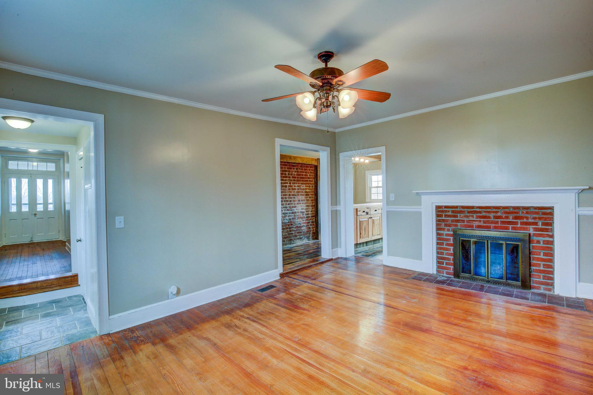 25208 Jerusalem Road Milford, VA 22514 - Photo 35 of 58 Living Room Leading to Original Double Front Doors