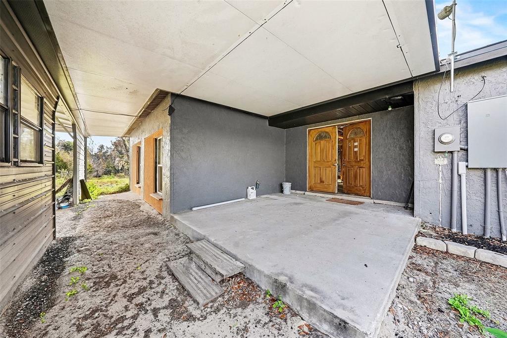 27178 Hickory Hill Road Brooksville, FL 34602 - Photo 7 of 18 a view of a livingroom with wooden floor and entryway