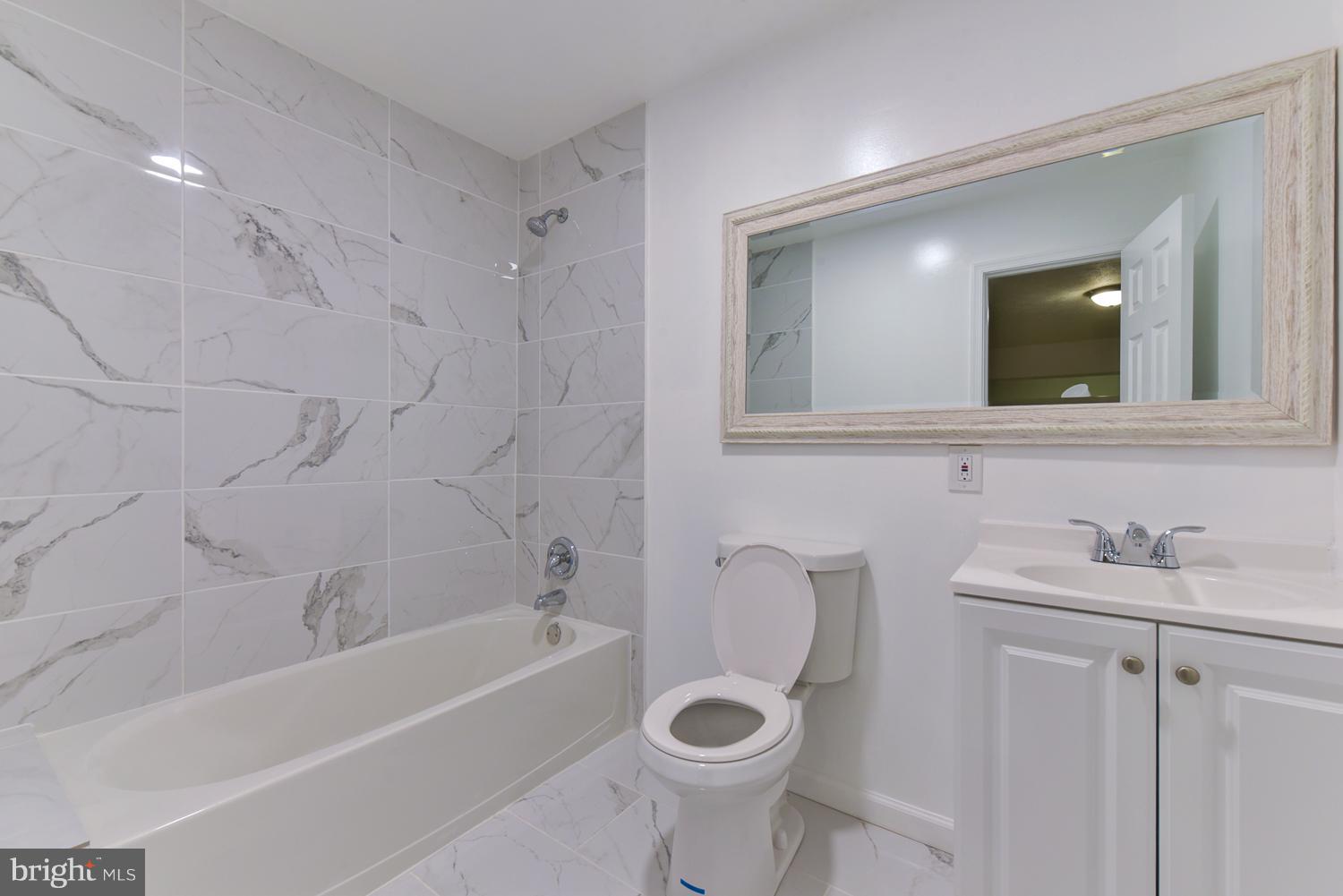 6507 Ronald Road Capitol Heights, MD 20743 - Photo 12 of 30 a bathroom with a sink toilet and shower