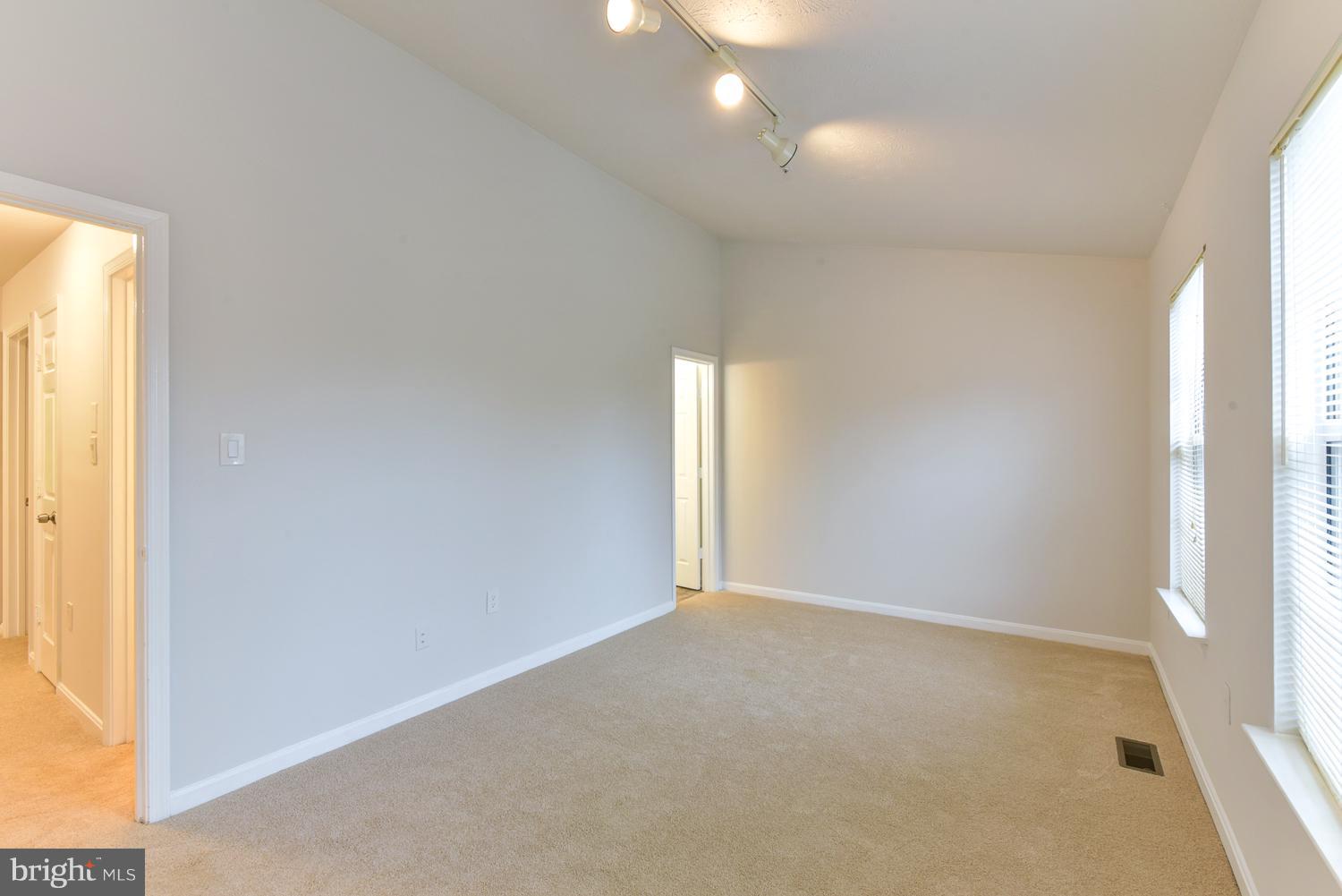 6507 Ronald Road Capitol Heights, MD 20743 - Photo 21 of 30 an empty room with windows and entrance