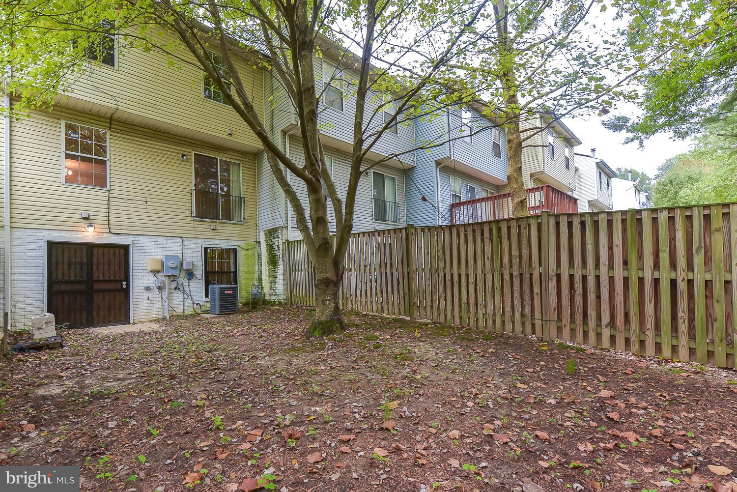 6507 Ronald Road Capitol Heights, MD 20743 - Photo 29 of 30 a view of a house with a small yard and large tree