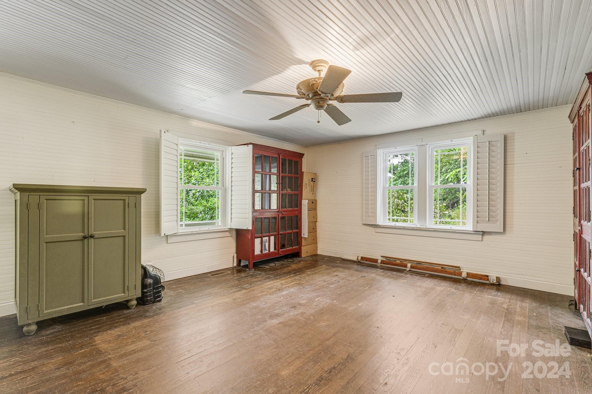71 Persimmon Lane Canton, NC 28716 - Photo 17 of 41 an empty room with windows and ceiling fan