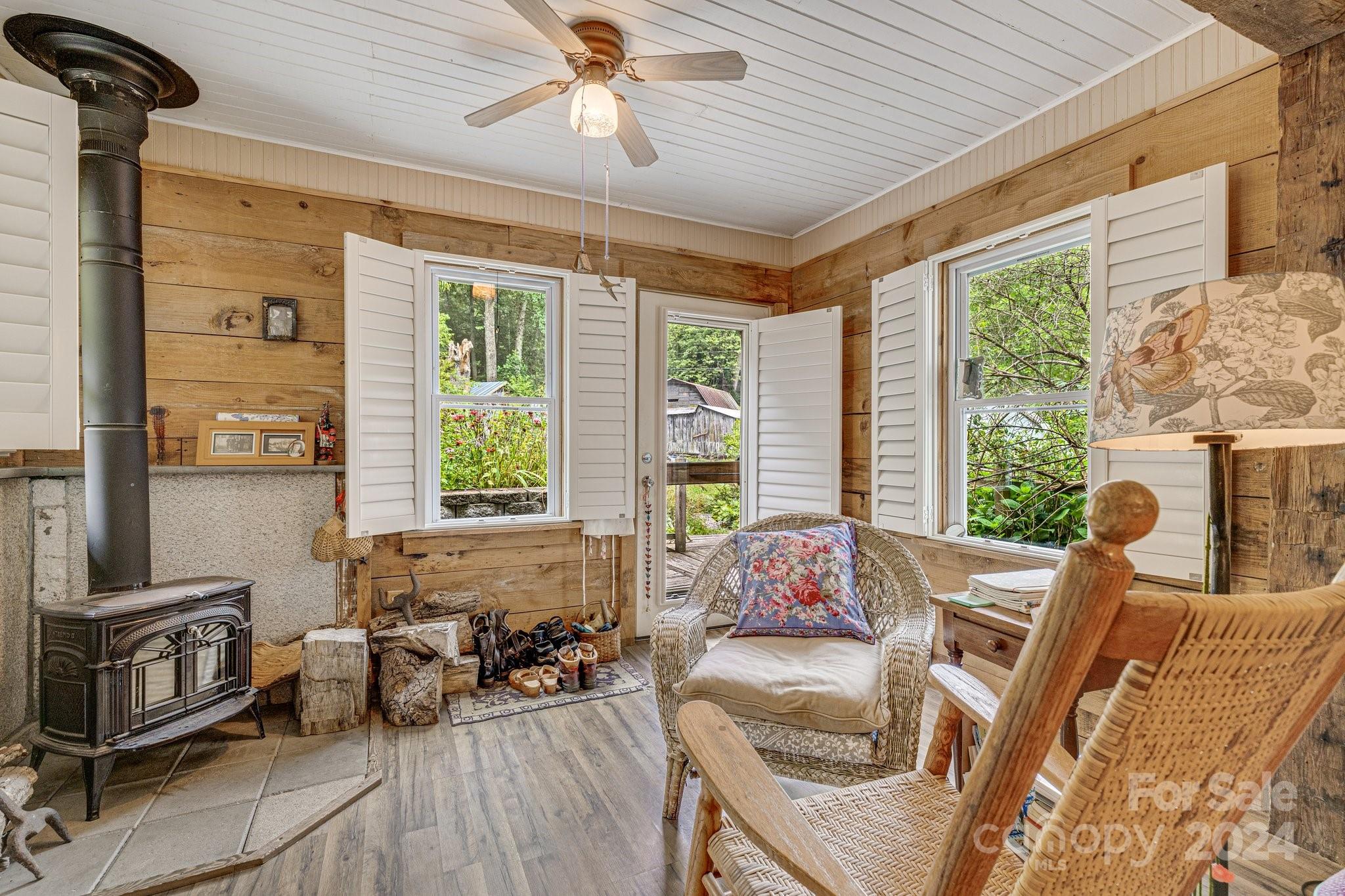 71 Persimmon Lane Canton, NC 28716 - Photo 3 of 41 a living room with furniture and a large window