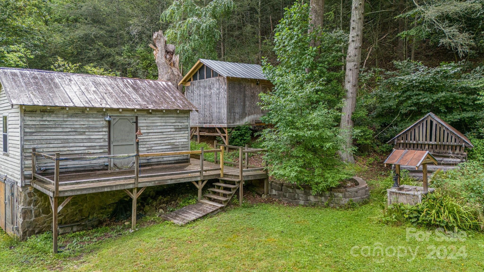 71 Persimmon Lane Canton, NC 28716 - Photo 34 of 41 a backyard of a house with seating space