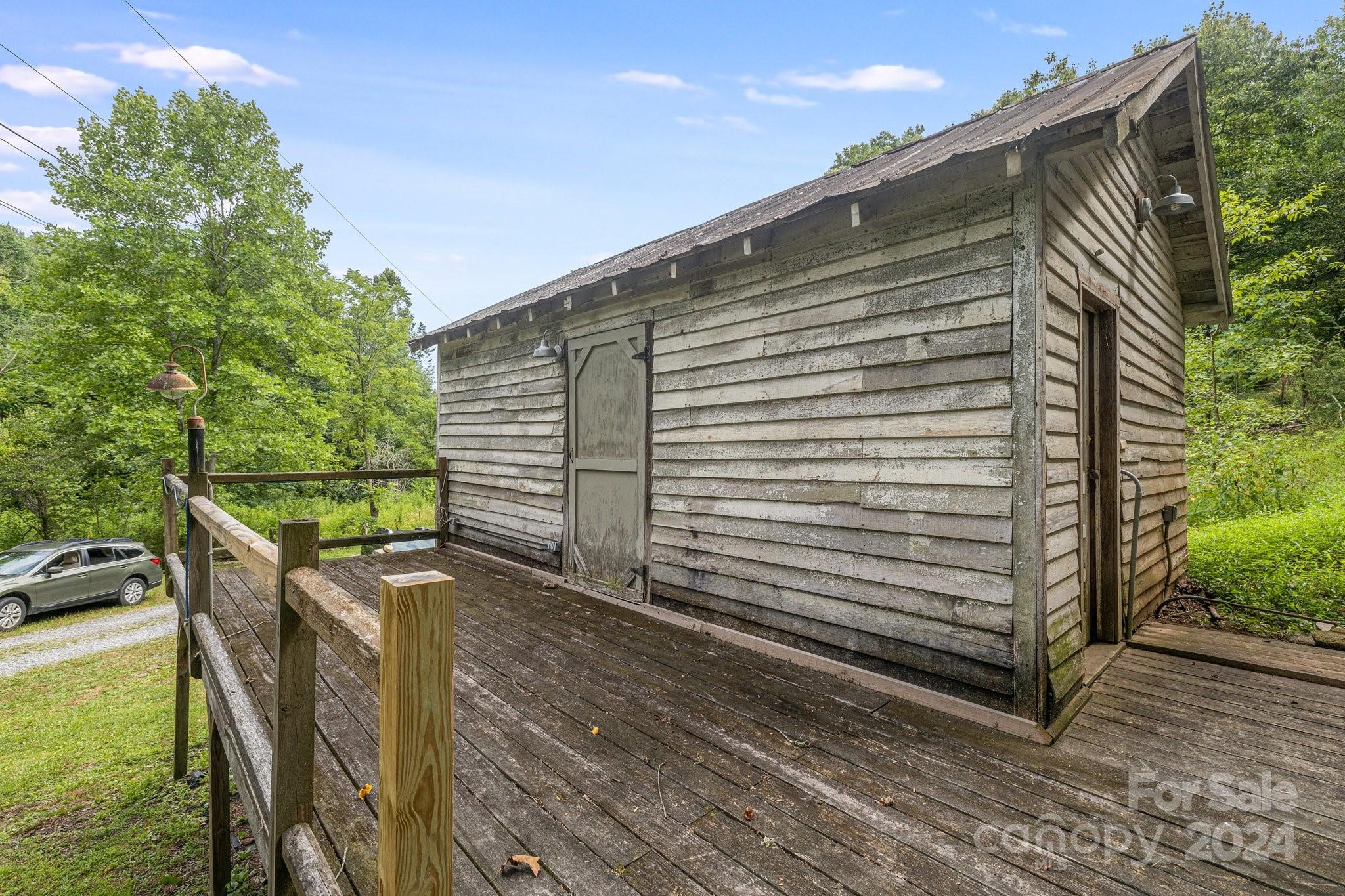 71 Persimmon Lane Canton, NC 28716 - Photo 35 of 41 a view of a backyard with sitting area