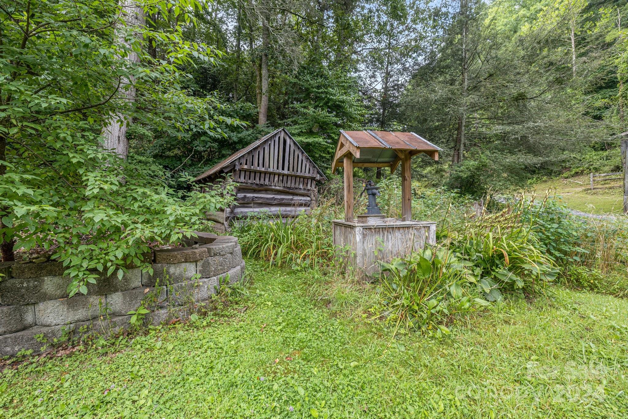 71 Persimmon Lane Canton, NC 28716 - Photo 38 of 41 a house view with a garden space