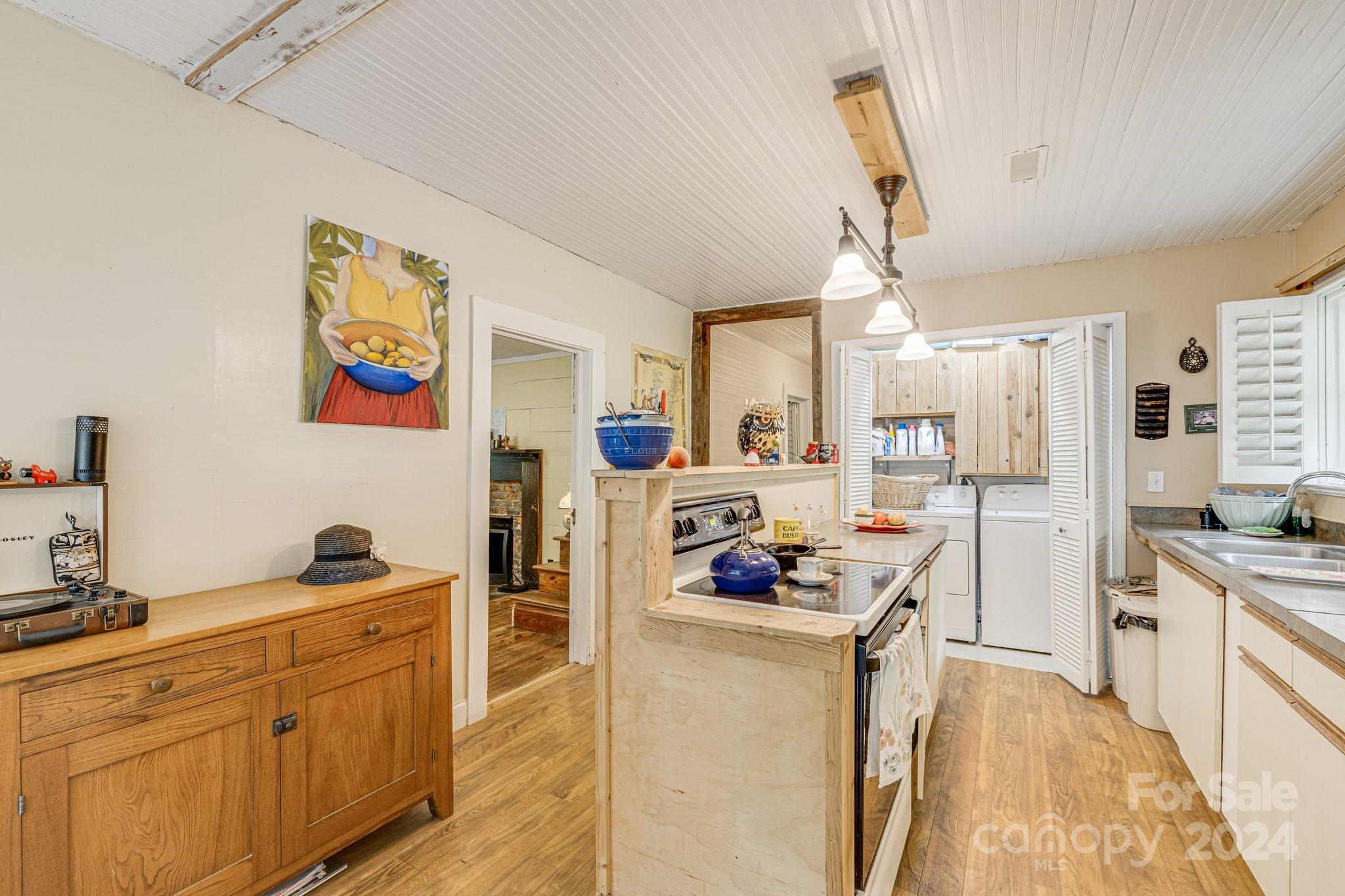71 Persimmon Lane Canton, NC 28716 - Photo 6 of 41 a kitchen with cabinets a sink and appliances