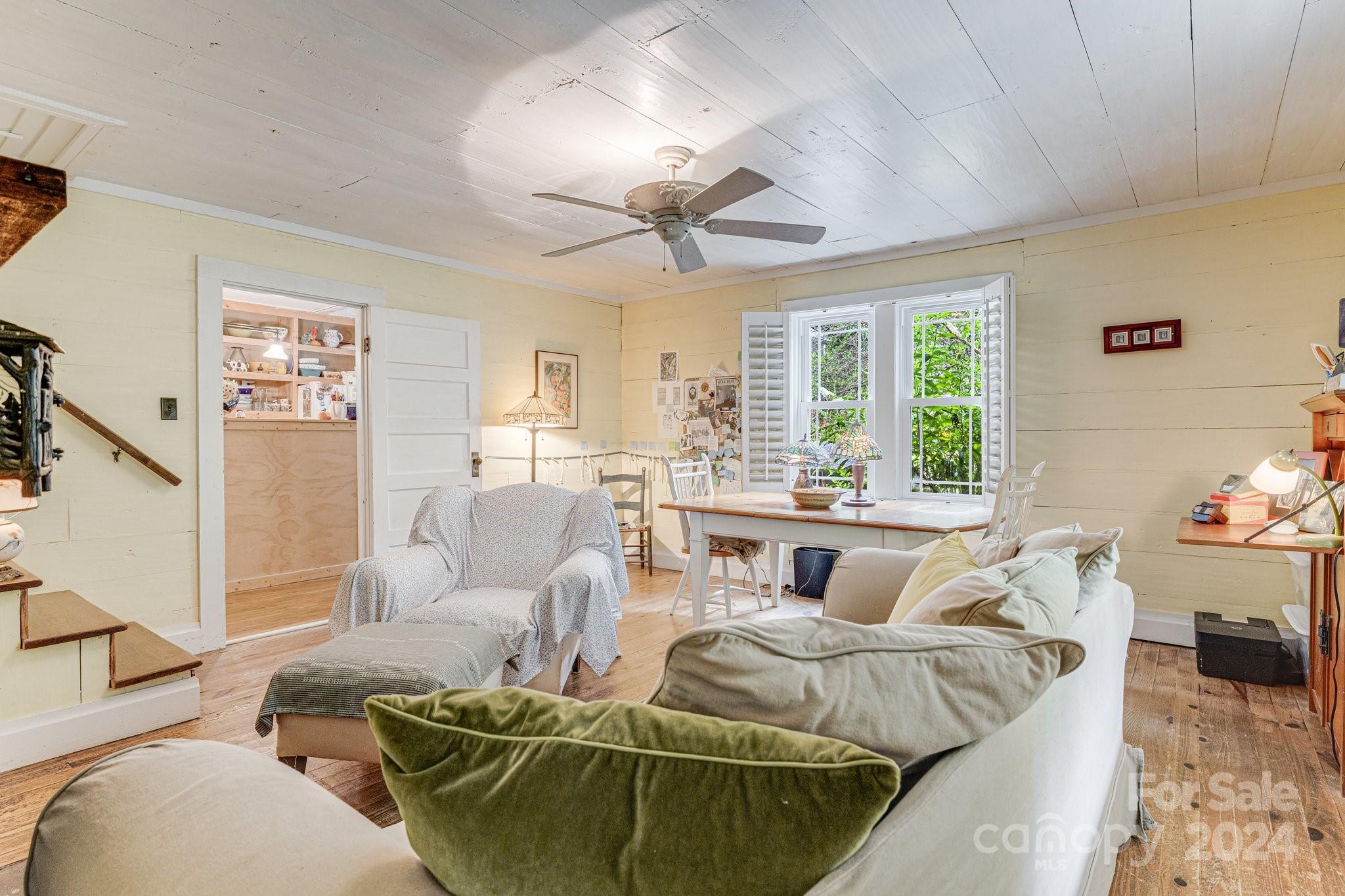 71 Persimmon Lane Canton, NC 28716 - Photo 9 of 41 a living room with furniture and a large window