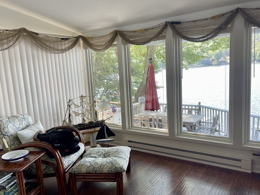 280 Mashapaug Road Holland, MA 01521 - Photo 19 of 36 a living room with furniture and a large window