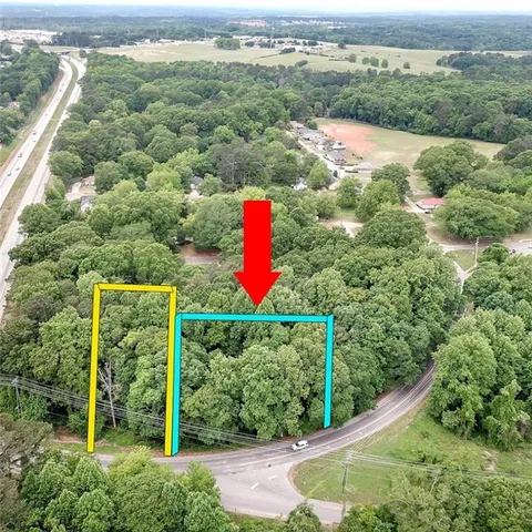 an aerial view of residential house with outdoor space and street view