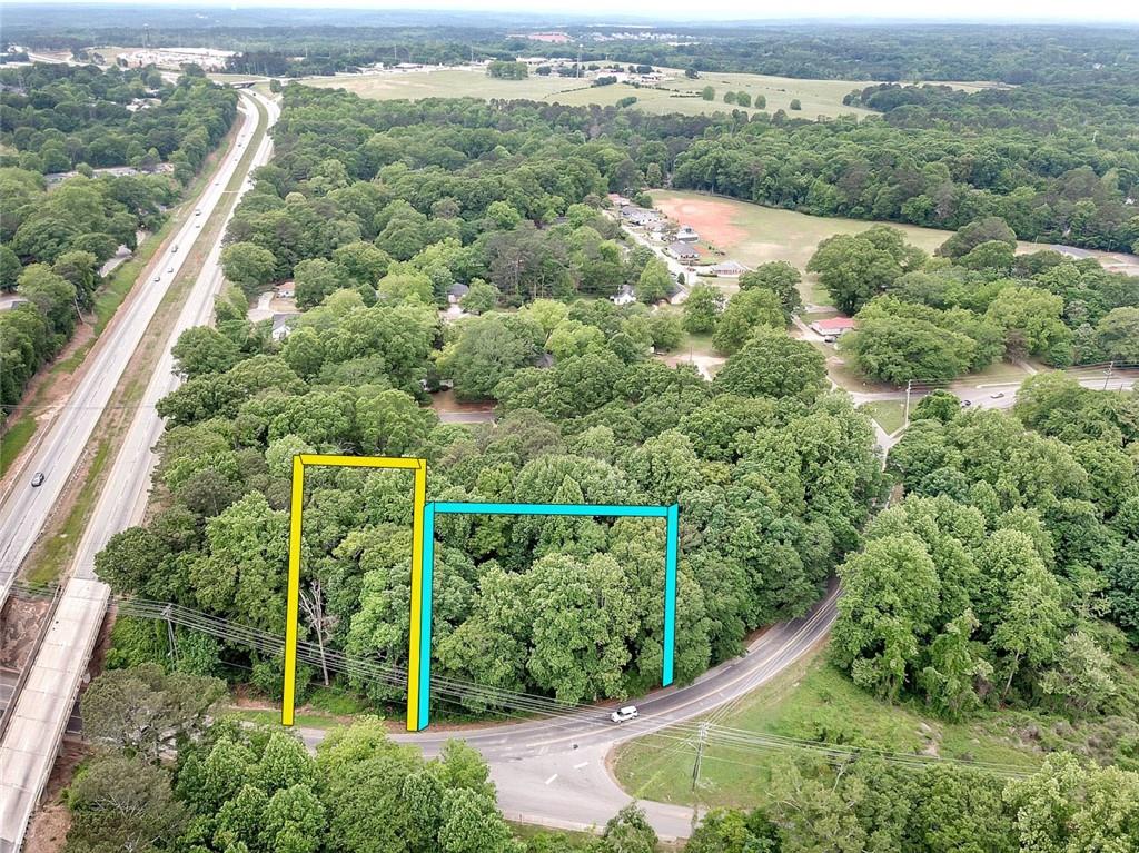 525 Birch Street Monroe, GA 30656 - Photo 2 of 6 an aerial view of a forest with houses