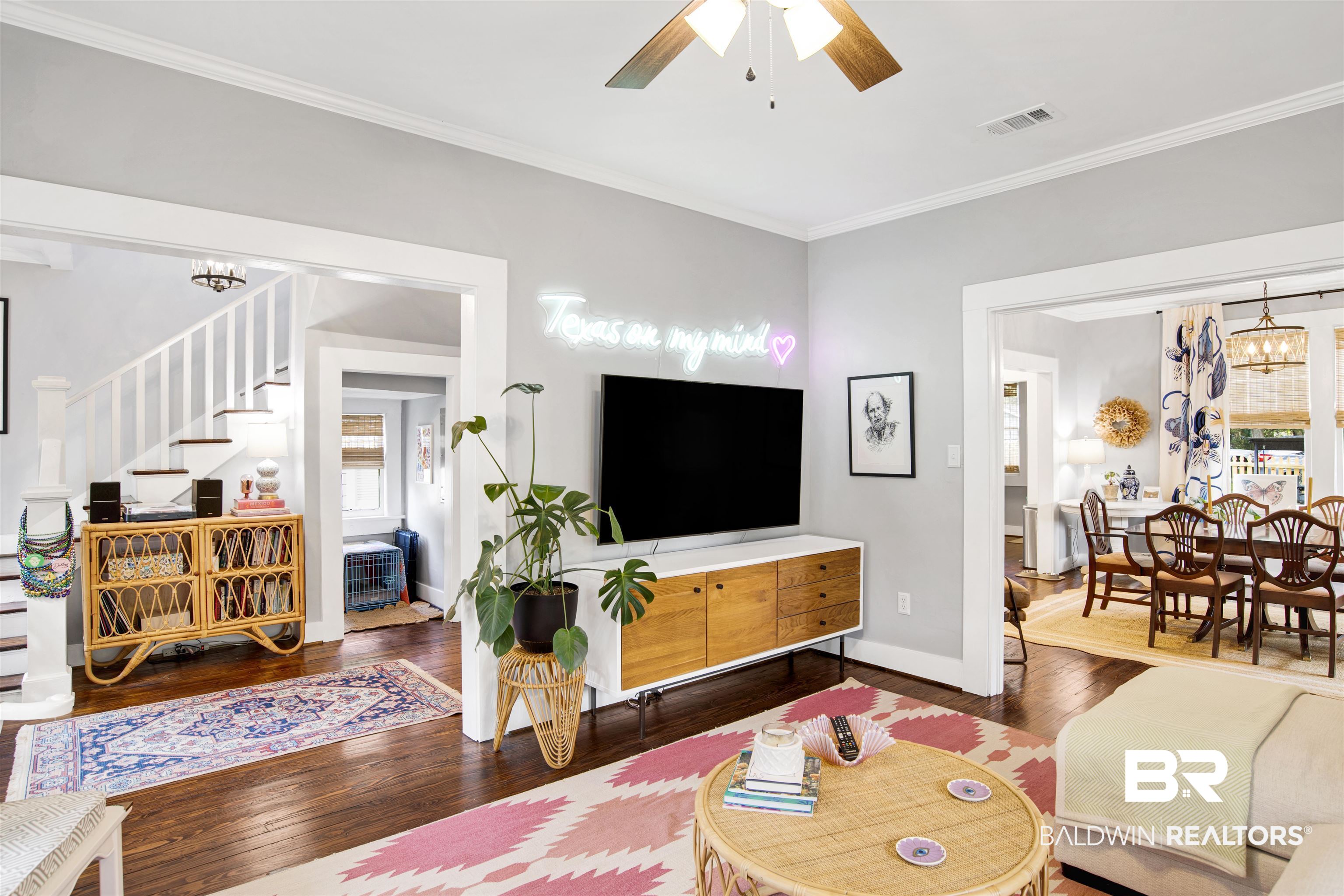 123 Macy Place Mobile, AL 36604 - Photo 25 of 35 Living area featuring a chandelier, ornamental molding, a ceiling fan, and dark wood-style floors