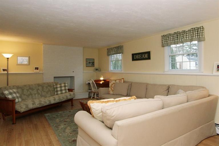 108 Uncle Percy's Road Mashpee, MA 02649 - Photo 11 of 18 a living room with furniture and a couch