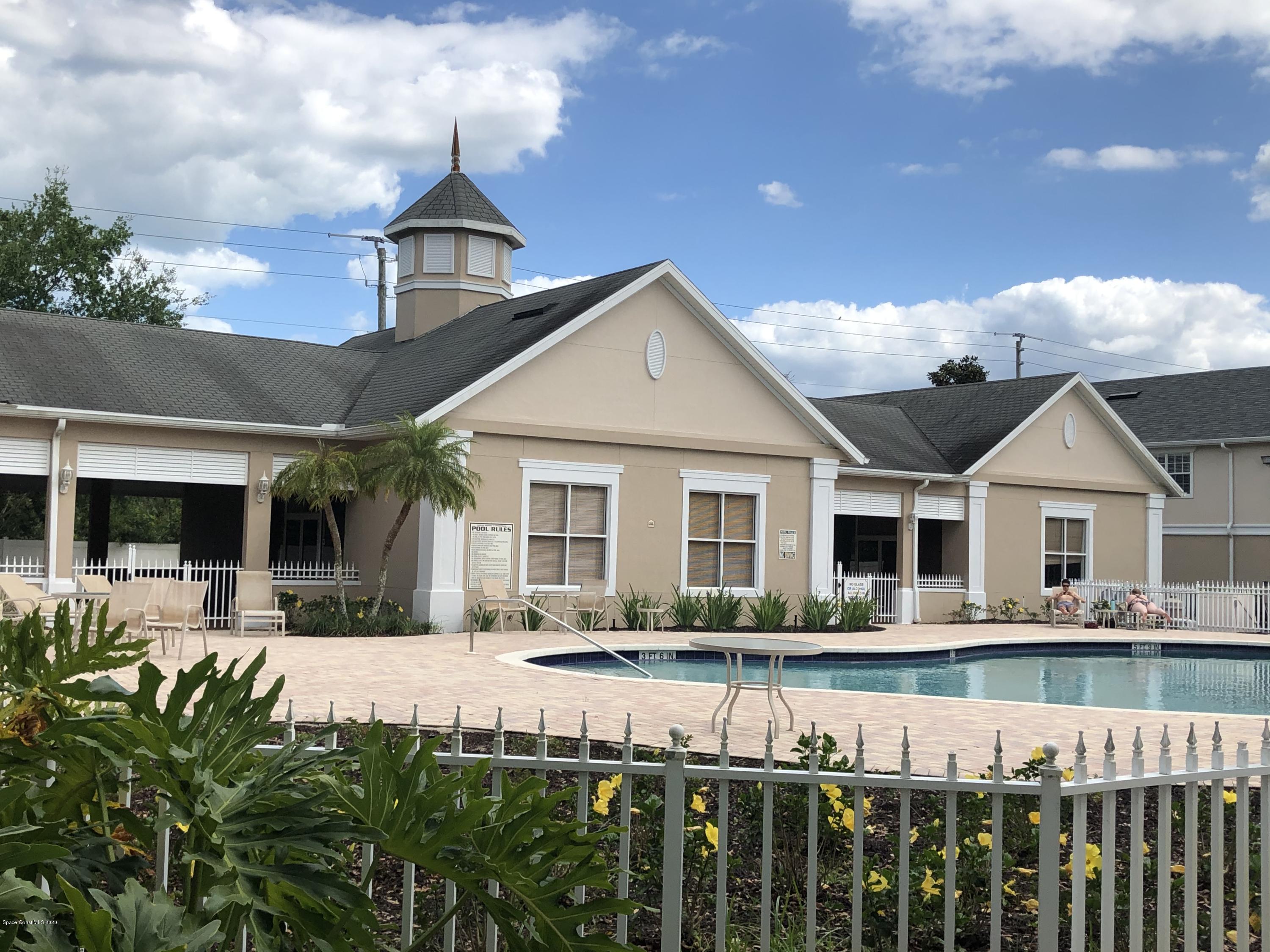 115 Turpial Way, Unit 106 Melbourne, FL 32901 - Photo 11 of 12 View of Pool from Front Dor