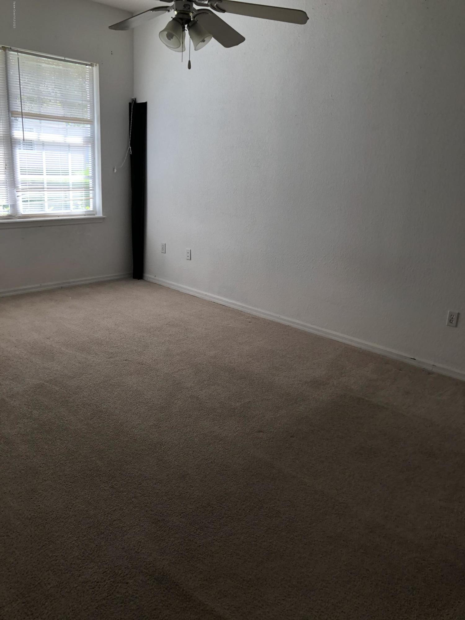 115 Turpial Way, Unit 106 Melbourne, FL 32901 - Photo 4 of 12 Master Bedroom/Downstairs
