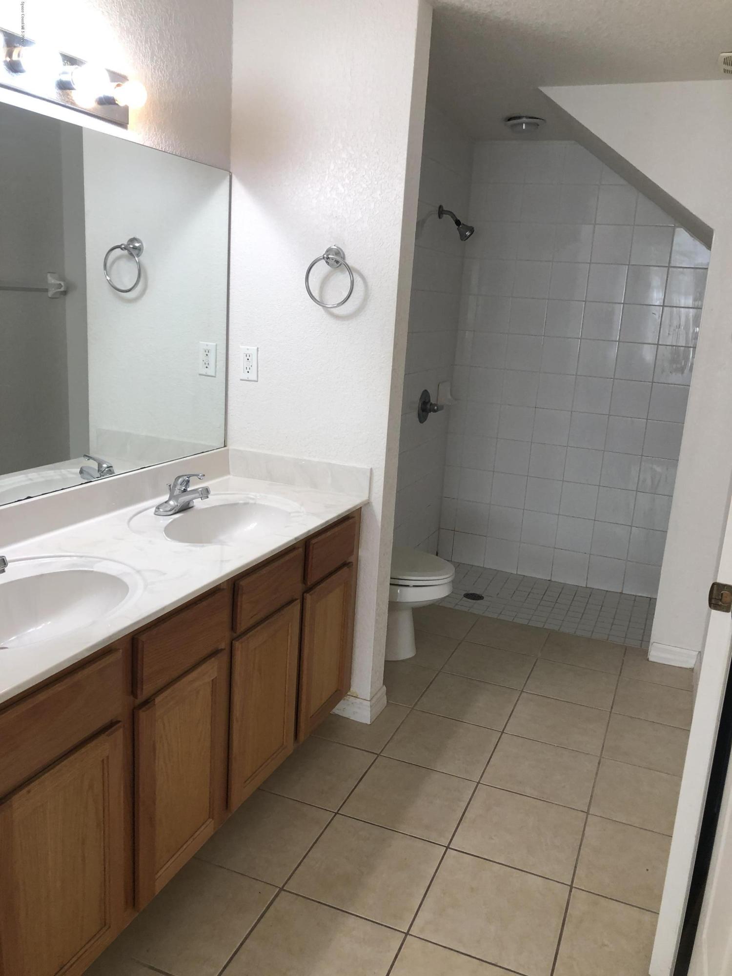 115 Turpial Way, Unit 106 Melbourne, FL 32901 - Photo 5 of 12 Master Bath