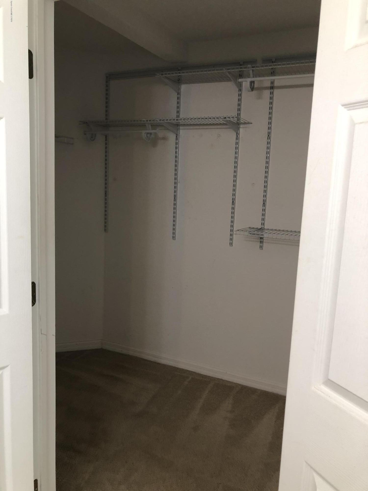 115 Turpial Way, Unit 106 Melbourne, FL 32901 - Photo 7 of 12 Master Walk-In Closet