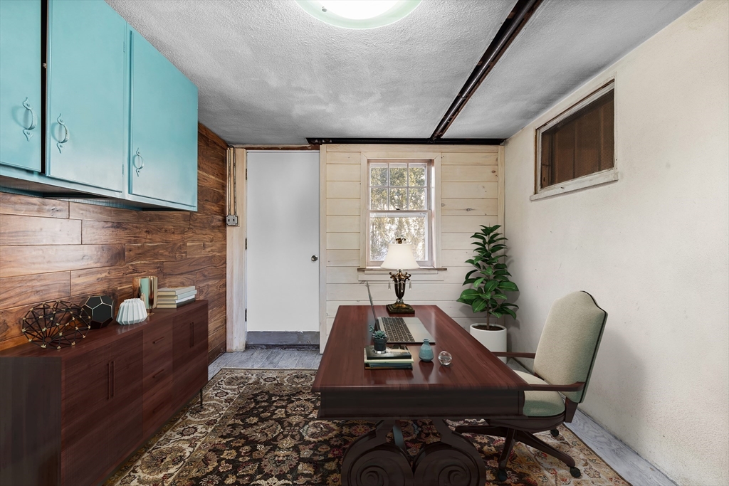 58 Watervale Road Medford, MA 02155 - Photo 25 of 41 a room with furniture and a potted plant