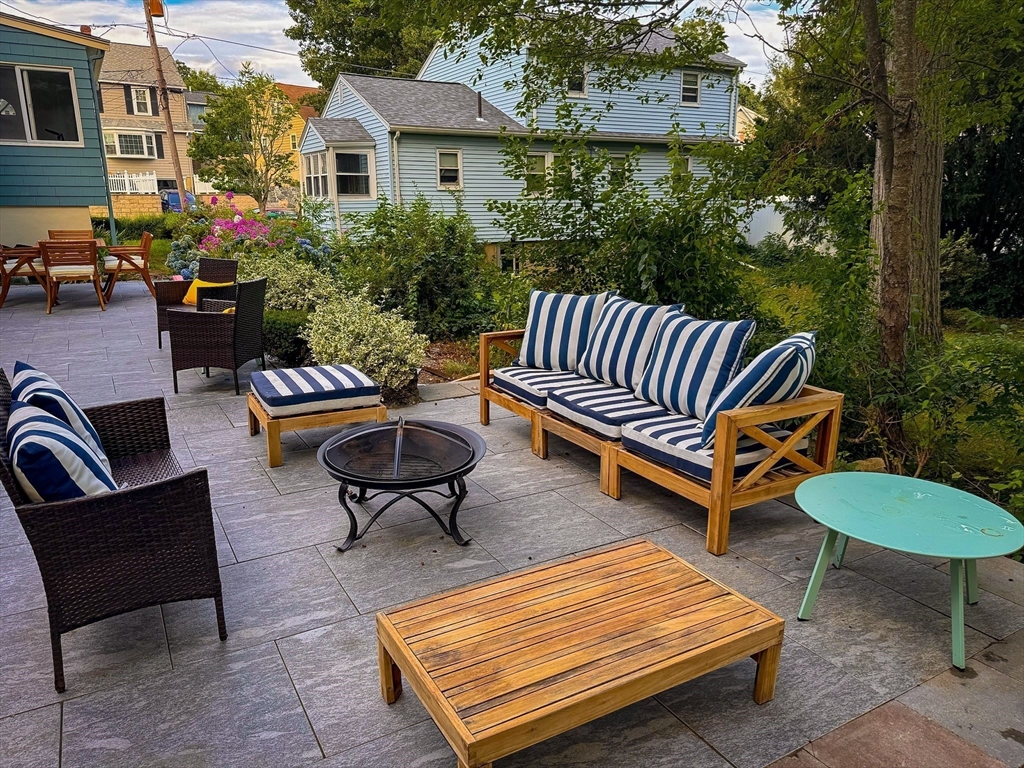 58 Watervale Road Medford, MA 02155 - Photo 34 of 41 a backyard of a house with table and chairs