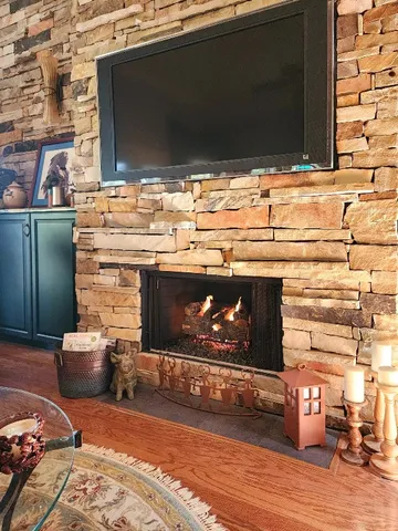 a view of fireplace and wooden floor