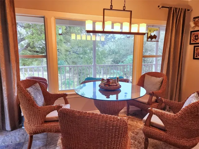 a view of a dining room with furniture window and outside view